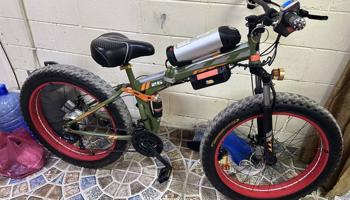 إعلان عن دراجة كهربائية للبر والشارع