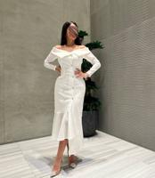 إعلان عن فستان لنن اوف وايت